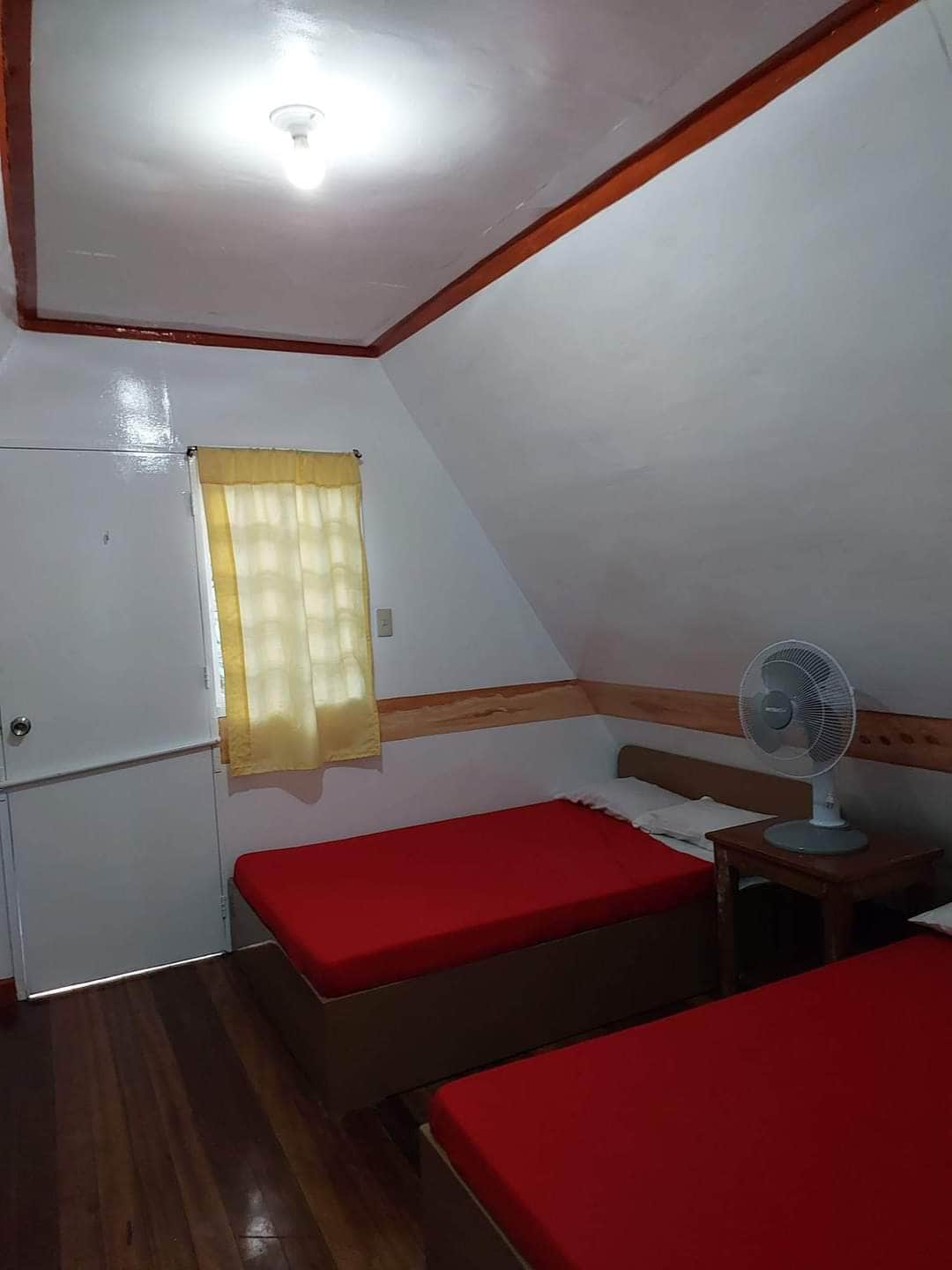 Twin attic room — warm hardwood floors