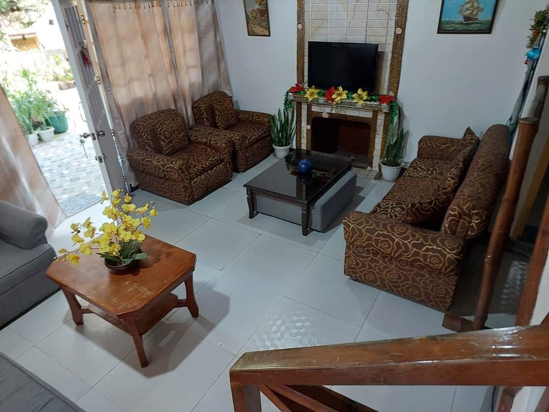 Sala aerial view — yellow orchids & cozy setting