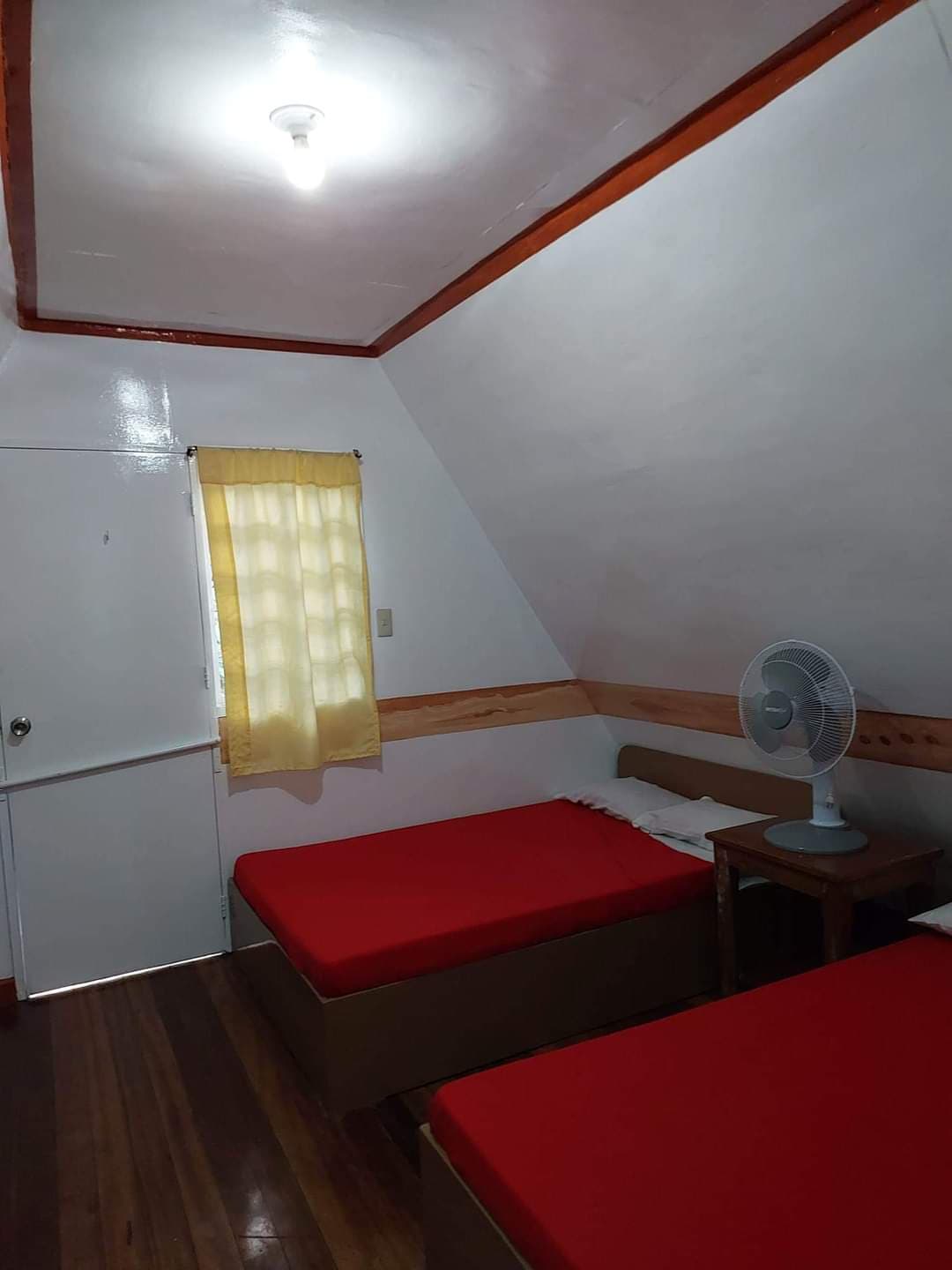 Twin attic room — warm hardwood floors