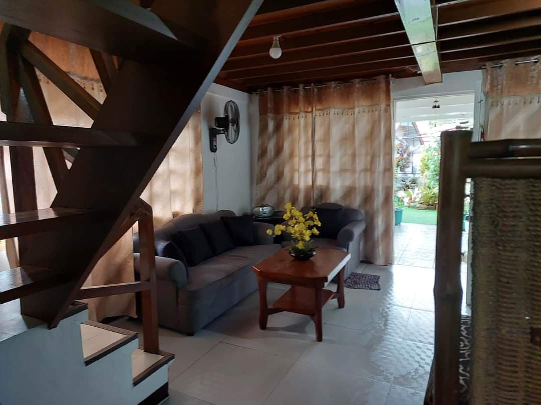 Ground floor sala with wooden staircase
